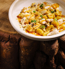 Delicious homemade pasta dish served on rustic wooden table