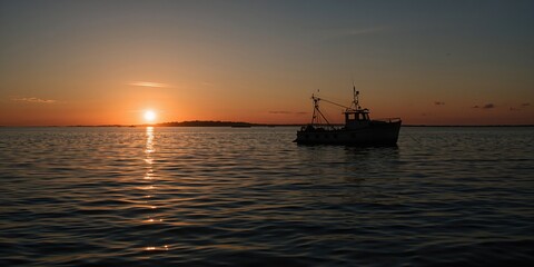 Two women embracing during a kitchen reunion, emphasizing emotional support and connection at a home gathering