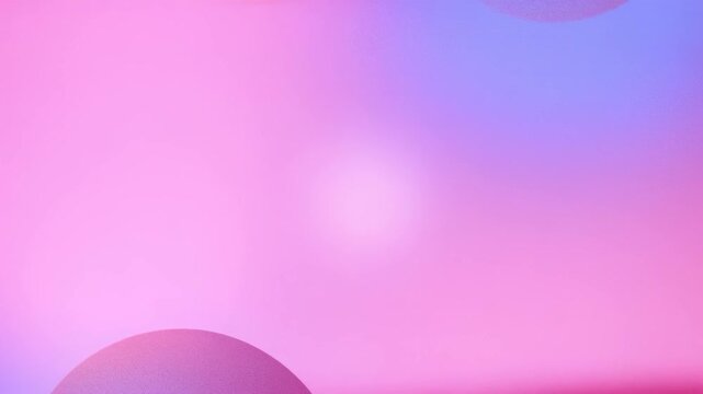 Abstract colorful gradient background with soft-focus effect and a logo watermark.