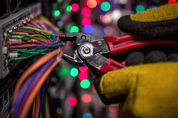 Electrician glove wire tool repair server closeup colorful maintenance safety cutting cable technology hand equipment professional electrical technician network connection hardware engineering