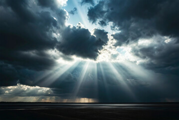 Dramatic light rays pierce through dark, heavy storm clouds, illuminating the horizon with a powerful and hopeful glow over a serene landscape, creating a majestic natural spectacle