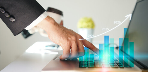 Businessman using laptop to analyze performance with business analytics dashboard. strategy planning and growth opportunities, calculating company investment