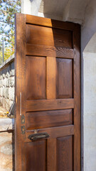 Open wooden door of traditional stone entrance in Tarakli Sakarya