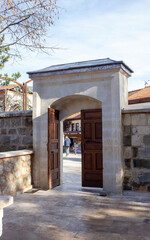 Historic stone entrance gate with wooden door in Tarakli Sakarya