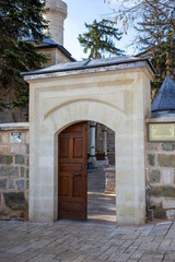 Historic stone entrance archway with wooden door in Tarakli Sakarya