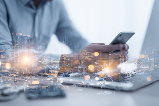 Big data, digital technology, internet network connection, futristic technology background. Man using mibile phobe and laptop and smart city