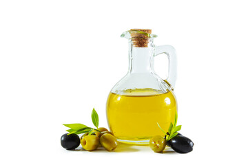 Extra virgin olive oil in a transparent jug and black and green olives with leaves.