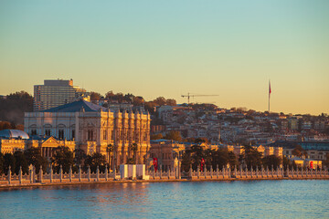 Dawn in Istanbul. Dolmabah&ccedil;e Palace on the shore of the Bosphorus, illuminated by the rising sun.