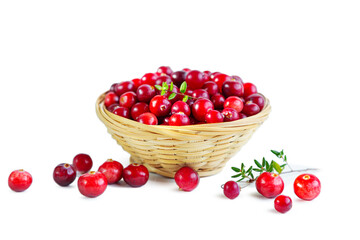 Cranberries in a wicker basket isolated on a white background.