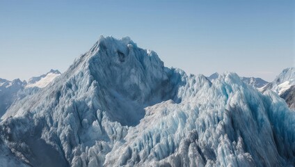 Aerial view showcasing a rugged, icy mountain range under a clear, blue sky
