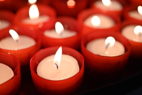 red candles on black background - Powered by Adobe