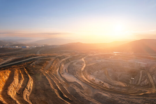 Panoramic of open pit mine industry, aerial view. Big yellow mining truck for coal working in quarry
