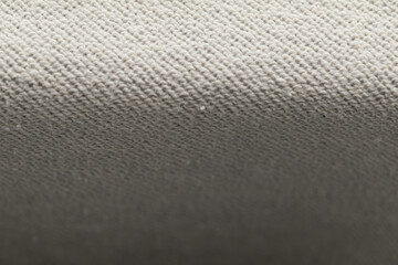 Macro photo of soft beige knitted fabric. Shallow depth of field creates a gentle gradient, highlighting the cozy, warm texture. Ideal for neutral backgrounds. ©  Colorshadow