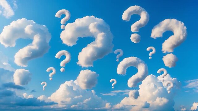 Fluffy white clouds forming question marks against a bright blue sky showcasing multiple cloud shapes and patterns during a sunny day capturing a whimsical and imaginative atmospheric scene.