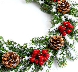 Snowy Pine Branches with Cones and Red Berries on White Background. Semicircular shape