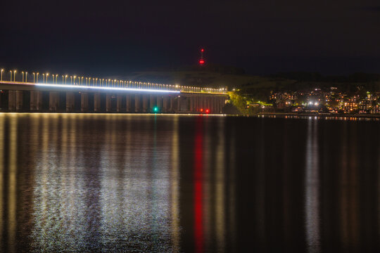 Tay road bridge illuminating river tay at night
