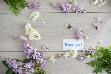 Flower frame of white and purple lilac with gratitude
