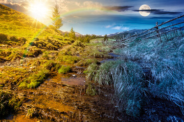 rural scene of mountain landscape on spring equinox. day and night time change concept. green...