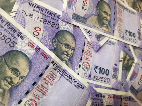 Close up view of indian currency, new 100 indian rupee banknotes