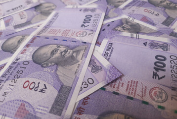 Indian one hundreds rupees bank note spread out randomly