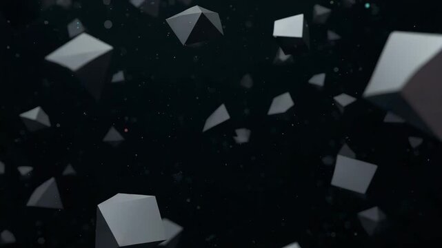 Dynamic floating geometric shapes composed of dark gray triangular prisms drifting gracefully in a dimly lit abstract environment with a blurred background and dust particles creating visual depth