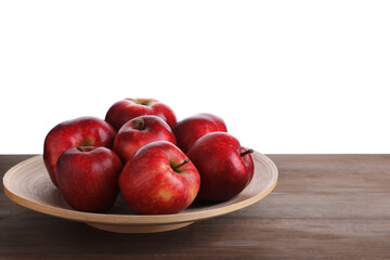 Ripe red apples on wooden table against white background, closeup. Space for text