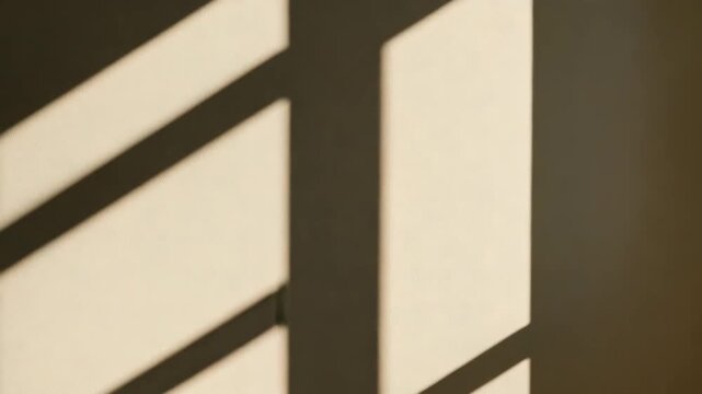 Dynamic patterns of shifting shadows cast on a textured wall from window blinds revealing subtle changes in light intensity and direction over time in a warm indoor environment