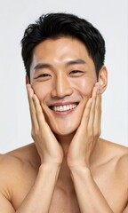 Smiling man touching his face, expressing happiness and wellness.