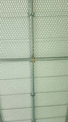 Steel pipe, green net, white sandwich panel, green fiber mesh, simple image, simple background