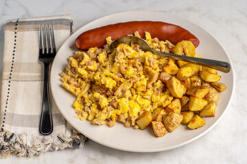 scramble eggs and corn beef hash  with  smoked sausage