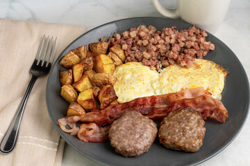eggs over easy with home fries and corn beef hash