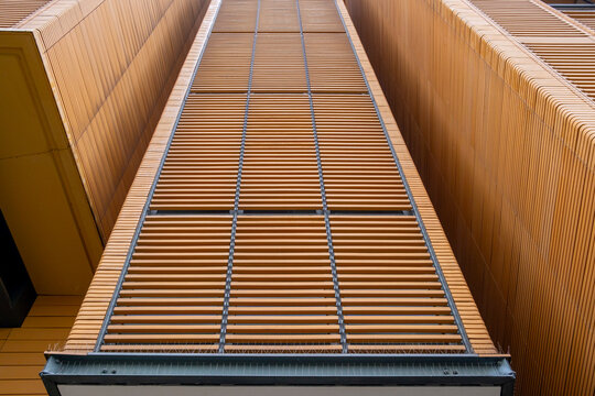 Upward modern architecture capturing facade grids and pattern sequences where geometry links with background surfaces and contrast to establish a structure shaped by abstract design and urban texture