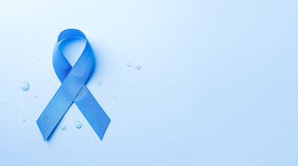 Blue awareness ribbon surrounded by water droplets on soft light background, symbolizing health awareness and support for medical causes