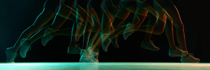 Fototapeta premium Dynamic runner motion trail with multicolor neon shift. Concept of speed analytics, athletic technique studies, performance tracking, and modern sports-science visuals full of kinetic energy. Banner