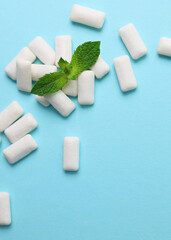 mint chewing gum and mint on the table. Fresh breath, oral care. Vertical photo format