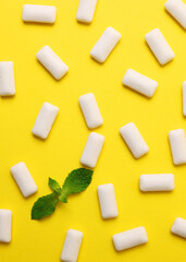 mint chewing gum and mint on the table. Fresh breath, oral care. Vertical photo format