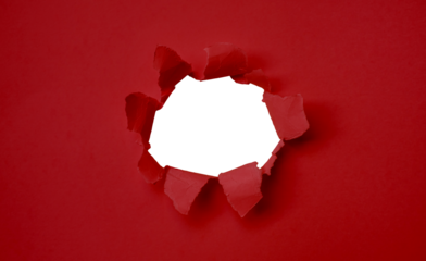 Torn red paper with a hole in the center and space to insert text. Suitable for use in marketing media to promote advertising content.