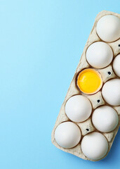 fresh farm chicken eggs on a colored background. Vertical photo format