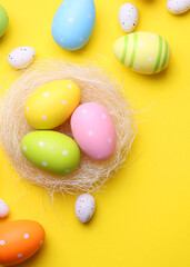 Easter eggs on a colored background, festive background . Vertical photo format