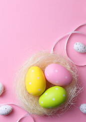 Easter eggs on a colored background, festive background . Vertical photo format