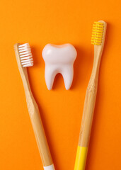 Different toothbrushes on a colored background. Dental care, oral health. Vertical photo format