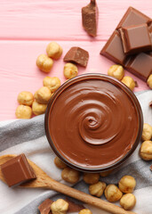 chocolate paste with a bowl on a table.  Vertical photo format