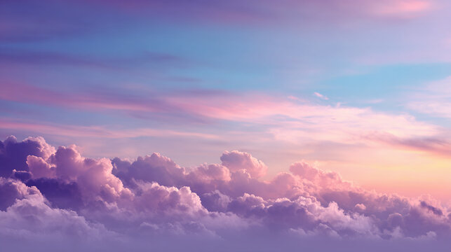 A serene view of fluffy clouds painted with hues of pink and purple, creating a dreamy sky