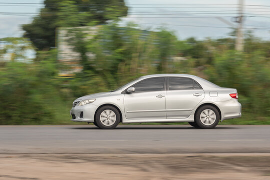 Nakhonsawan, Thailand - Oct, 2025: Toyota Corolla Altis, A silver car to speed running on the highway, on October 24, 2025, at Nakhon Sawan, Thailand.