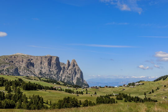 View over the alpine meadows towards the peaks of the Schlern on the Seiser Alm, Dolomites, South Tyrol, Italy.