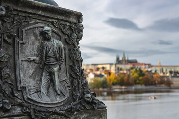 Historic Bridge Relief Facing Prague Castle Skyline