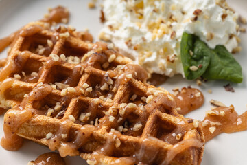 Close-Up of Belgian Waffles with Caramel and Cream