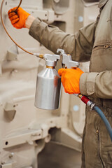 Professional anti corrosion undercoating treatment applied to hidden cavities of a car body. Long lasting metal protection and technical maintenance for extended vehicle lifespan.