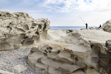 Eroded rock formations on the beach in Bordighera on the italian riviera