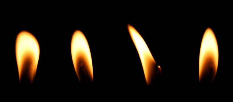 set candle flame is burning at night in close range, yellow light isolated on a black background. Concept for taking graphics for birthdays, Halloween, and Christmas. glow wick - Powered by Adobe